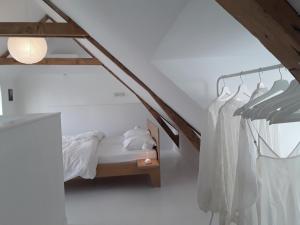 Postel nebo postele na pokoji v ubytování Maan B&B + Galerie