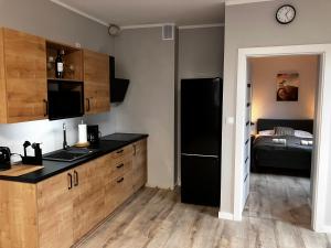 Kuchyňa alebo kuchynka v ubytovaní Apartamenty Czarna Perła