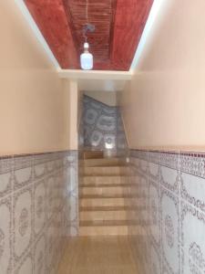 a room with a staircase with a ceiling at Appartement de luxe à el jadida in El Jadida