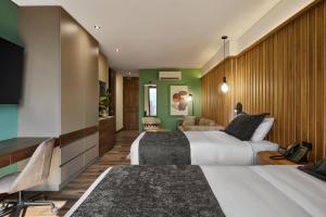 Postel nebo postele na pokoji v ubytování Blues Suites Medellín