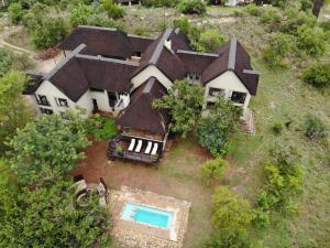 an aerial view of a large house with a swimming pool at 211 Zebula in Mabula