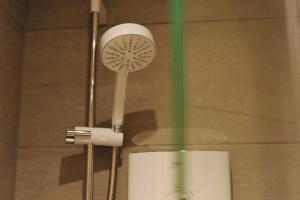 a white hair dryer with a fan in a room at No. 3 Bligh's Yard in Canterbury