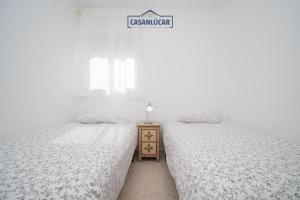 Łóżko lub łóżka w pokoju w obiekcie Apartamento Cigüeña