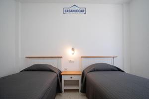 Łóżko lub łóżka w pokoju w obiekcie Apartamento Cigüeña