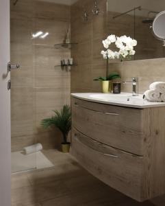 a bathroom with a sink and a shower at A Casa Tua in Bologna