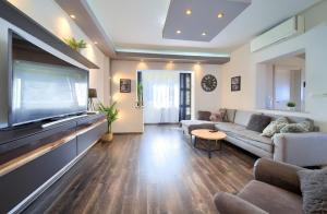 a living room with a large flat screen tv at Luxury apartments Vanessa, Njivice in Njivice