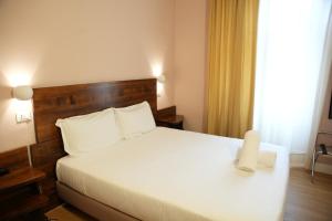 Postel nebo postele na pokoji v ubytování Hotel Montevecchio