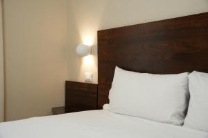 Postel nebo postele na pokoji v ubytování Hotel Montevecchio