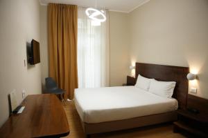 Postel nebo postele na pokoji v ubytování Hotel Montevecchio