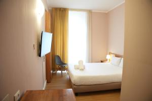 Postel nebo postele na pokoji v ubytování Hotel Montevecchio