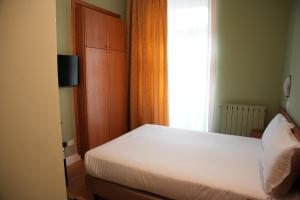 Postel nebo postele na pokoji v ubytování Hotel Montevecchio