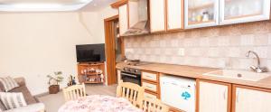a kitchen with a sink and a counter top at Явор in Tryavna