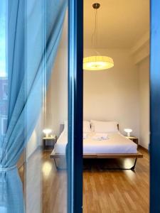Łóżko lub łóżka w pokoju w obiekcie Imago Plus Hotel
