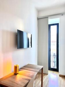 Telewizja i/lub zestaw kina domowego w obiekcie Imago Plus Hotel