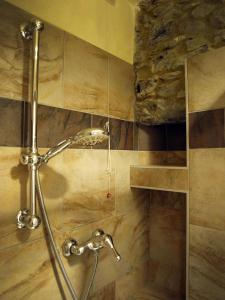 a shower in a bathroom with a stone wall at Pietre di Mare in Monterosso al Mare