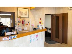an office with a counter and a reception desk at Business Hotel Lupinus - Vacation STAY 55765v in Takamatsu