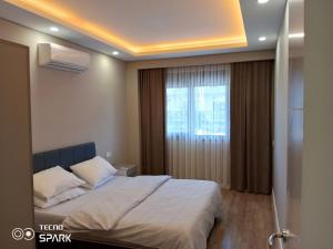Postel nebo postele na pokoji v ubytování Mali Garden Residence