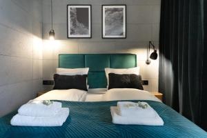 Ліжко або ліжка в номері Baltica Towers by Symphony Aparthotels