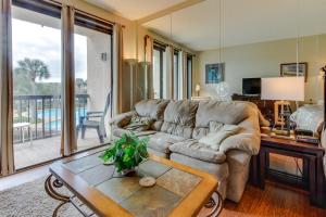 a living room with a couch and a table at Pirates Bay A204 in Fort Walton Beach