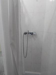 a shower with a shower curtain in a bathroom at Casa Aires Varela in Elvas