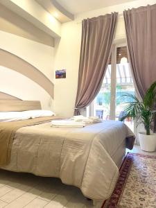A bed or beds in a room at Terrazza Garibaldi