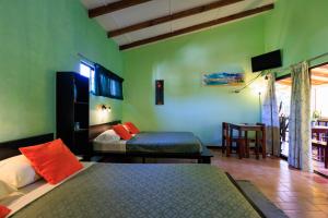 Postel nebo postele na pokoji v ubytování Hotel Boutique La Casa de las Flores + 37 fotografií