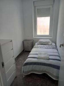 Posteľ alebo postele v izbe v ubytovaní Apartamento cerca del puerto y del paseo
