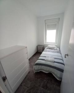 Posteľ alebo postele v izbe v ubytovaní Apartamento cerca del puerto y del paseo