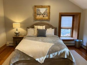 a bedroom with a large bed and a window at High Meadows Estate in Purcellville