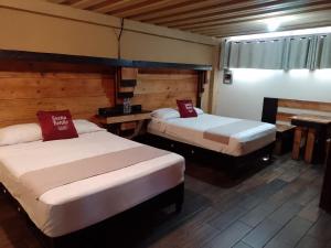 Postel nebo postele na pokoji v ubytování Casa Bonita Hotel y Hostal