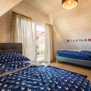 Postel nebo postele na pokoji v ubytování Pod Morskim Niebem