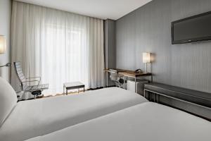Postel nebo postele na pokoji v ubytování AC Hotel Burgos by Marriott