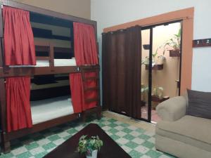 Postel nebo postele na pokoji v ubytování Casa Bonita Hotel y Hostal