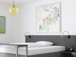 Postel nebo postele na pokoji v ubytování Lendhotel
