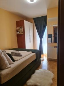 Postel nebo postele na pokoji v ubytování Apartman *Joy*