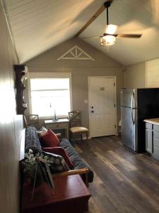 a living room with a couch and a refrigerator at Lakefront Cabin - Sunset Cove - 15 in Mead