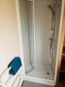 a shower with a glass door in a bathroom at Kent Coast 3 bedroom holiday home in Rochester