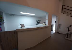 an empty room with a counter in a building at Ayenda Colombia Avenida in Medellín
