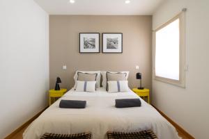 Ένα ή περισσότερα κρεβάτια σε δωμάτιο στο Casa da Raquel