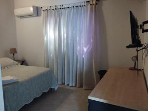 Katil atau katil-katil dalam bilik di El Hogar de Ami