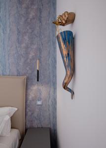 a room with a mermaid hanging on the wall at I Canestrari in Naples