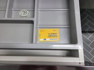 a drawer with a yellow sign on it at Yeongtong Family House in Suwon