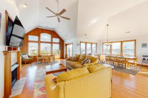 a living room with two couches and a tv at Wind Chimes #51-1 in Avon