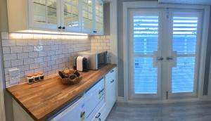 a kitchen with a counter top with a microwave at Hamptons In Rye Studio - 3 Mins from Famous Hot Springs! in Rye