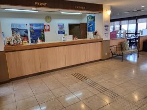 a waiting area of a fast food restaurant with a counter at Tsushima Dae-A Hotel in Tsushima