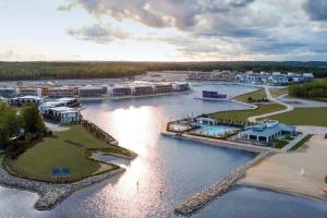 an aerial view of a resort on a river at Stunning Stayz At Friday Harbour Beach Marina Resort Lake Simcoe Innisfil in Innisfil