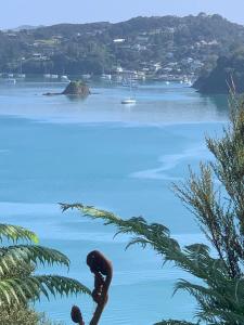 a view of a body of water with a boat at Sea Veiws Kaha Place in Russell