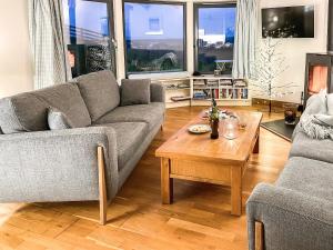 a living room with a couch and a coffee table at High Trodigal in Machrihanish