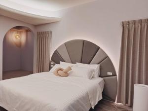 Postel nebo postele na pokoji v ubytování 鴝花甜點民宿 QuHua Sweety B&B