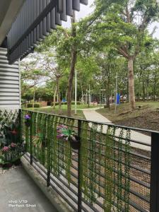 a balcony with plants on the side of a building at Summer Glades, Cyberjaya in Cyberjaya